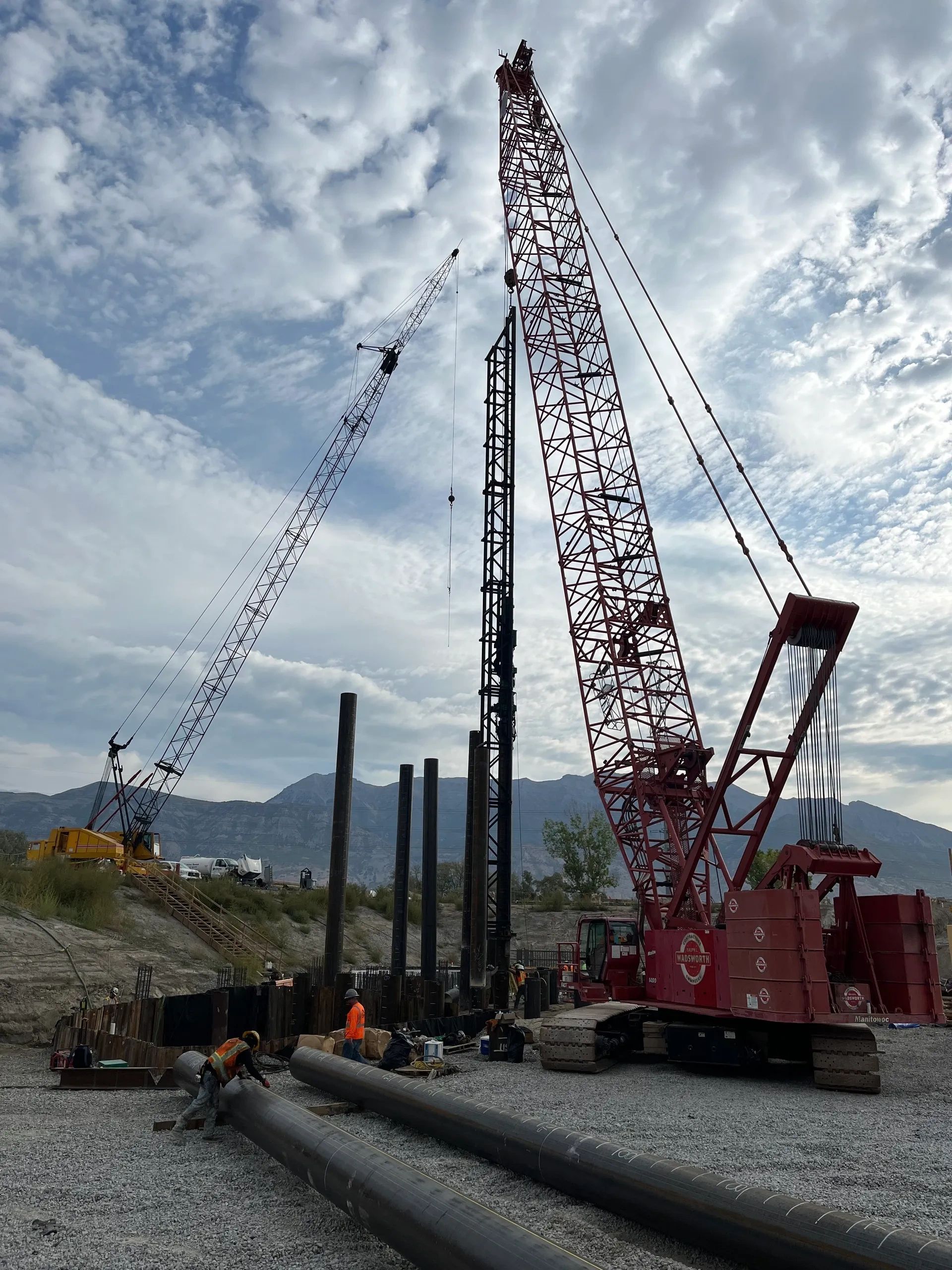 Large crane and pile driving equipment at a construction site